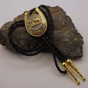 Western bolo tie horseshoe with praying cowboy at grave colors silver / gold