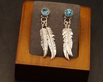 Sterling silver earrings with turquoise stones and feathers