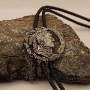 Western bolo tie Indian head in laurel wreath with feathers