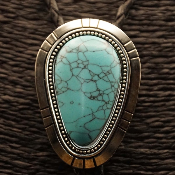 Bolo tie with turquoise stone in drop shape and silver-colored edge