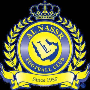 May include: A yellow and blue circular logo with the text "AL NASSR FOOTBALL CLUB" and "Since 1955" on a banner. The logo features a crown, a laurel wreath, and a stylized map of Saudi Arabia.
