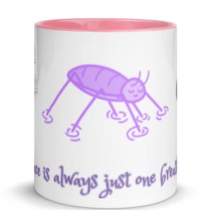 May include: A white ceramic mug with a pink interior rim featuring a purple illustration of a water strider insect on the surface. Below the insect, the text reads, Peace is always just one breath away, written in a purple cursive script font.