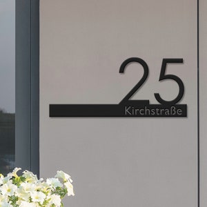 May include: Black metal house number sign with the number 25 and the street name Kirchstra&szlig;e.