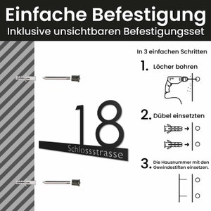 May include: A black metal house number '18' with the word 'Schlossstrasse' underneath. The image shows how to install the house number with a drill, anchors, and screws.
