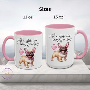 May include: Two white ceramic mugs with pink rims. The 11 ounce mug and the 15 ounce mug both feature a pink-rimmed design and a graphic of a French bulldog wearing pink heart-shaped glasses. The text on the mug reads "Just a girl who loves frenchies".