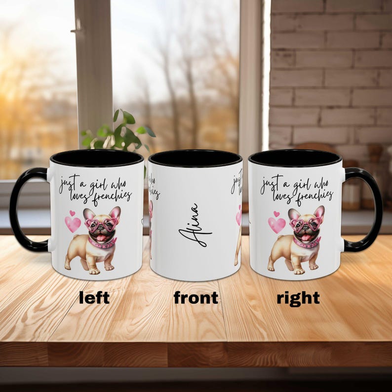 May include: Black and white coffee mug with a black handle. The mug has a white interior and a design featuring a cartoon French bulldog wearing pink sunglasses and the text "just a girl who loves frenchies". The mug also has the name "Alina" printed on the front.