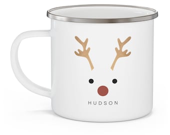 May include: White enamel mug with a gold reindeer face and the name "HUDSON" printed on the bottom.