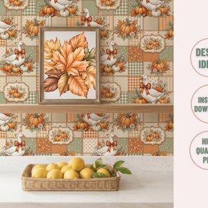 May include: A digital graphic design featuring a repeating pattern of white geese with orange bows, pumpkins, and autumn leaves. A framed print of orange and brown maple leaves sits on a wooden shelf above a woven basket filled with yellow lemons.