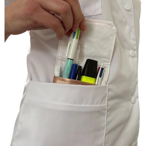 May include: A white lab coat with a large pocket on the left side. The pocket is filled with various pens and a highlighter. The pens are blue, black, green, and white.