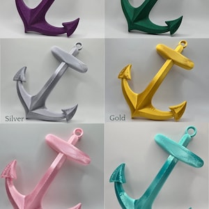 May include: Six 3D printed anchors in different colors: glitter galaxy purple, glitter emerald green, silver, gold, silky pink, and silky green. The anchors are all the same size and shape, and they are all facing the same direction. The anchors are all on a white background.