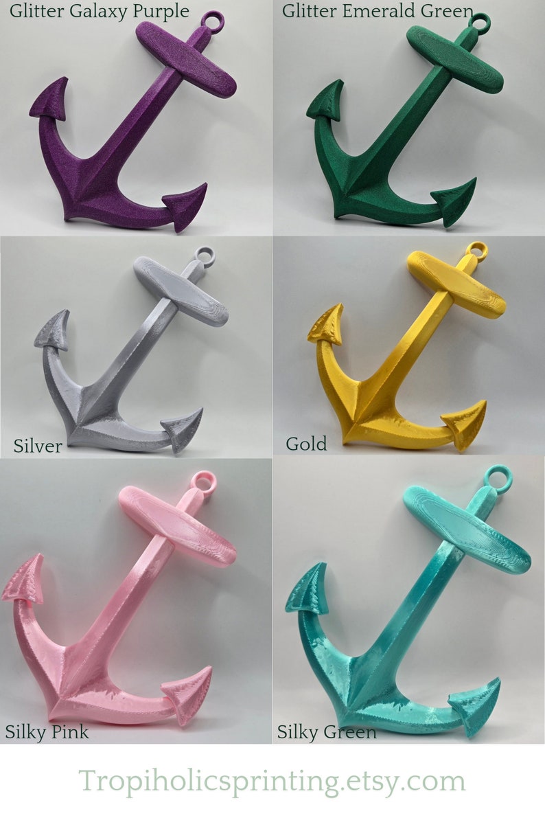 May include: Six 3D printed anchors in different colors: glitter galaxy purple, glitter emerald green, silver, gold, silky pink, and silky green. The anchors are all the same size and shape, and they are all facing the same direction. The anchors are all on a white background.