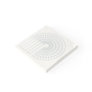 May include: A white notepad with a blue grid pattern in the shape of a circle and a straight line. The notepad is designed for tracking habits or goals.