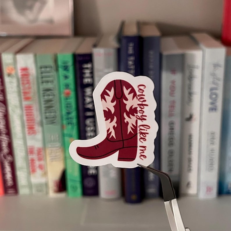 May include: A red cowboy boot sticker with white accents and the text "Cowboy like me".
