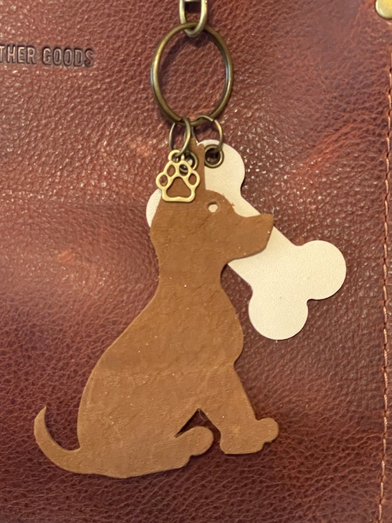 Dog Bone & Paw charm made with Portland Leather Goods leather. Available in 9 PLG colors. Bone is made with PLG Bone color. Antique brass HW