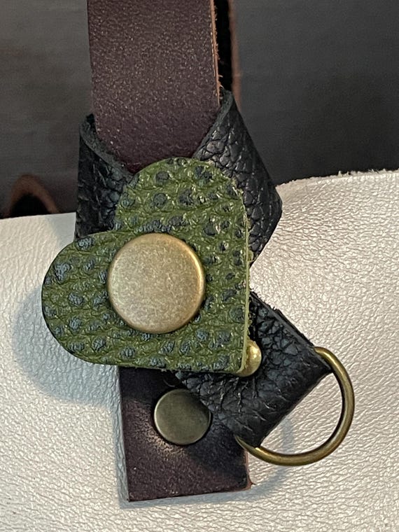 Flair holder to safely attach charms to PLG Portland Leather Goods bags Made with pebble black Avocado full grain leather. Bronze hardware