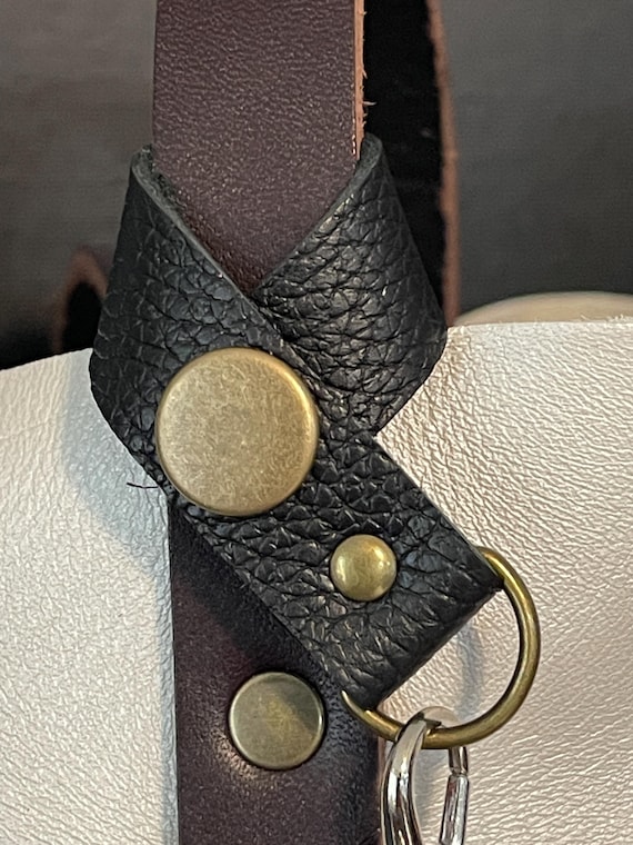 Flair holder to safely attach charms to your PLG Portland Leather Goods bags. Made with pebble black full grain leather. Bronze hardware