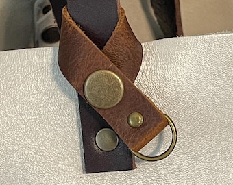 Flair holder to safely attach charms to your PLG Portland Leather Goods bags. Made with  brown full grain leather. Bronze hardware