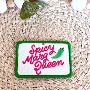 May include: White embroidered patch with green border. The patch says "Spicy Marg Queen" in pink cursive lettering with a green chili pepper graphic.