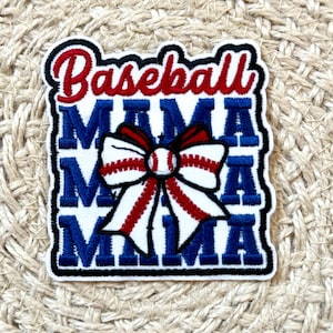 May include: Embroidered patch with the words "Baseball Mama" in red and blue. The word "Mama" is repeated three times in blue. A baseball-themed bow with red and white stripes and a baseball center is in the centre of the patch.