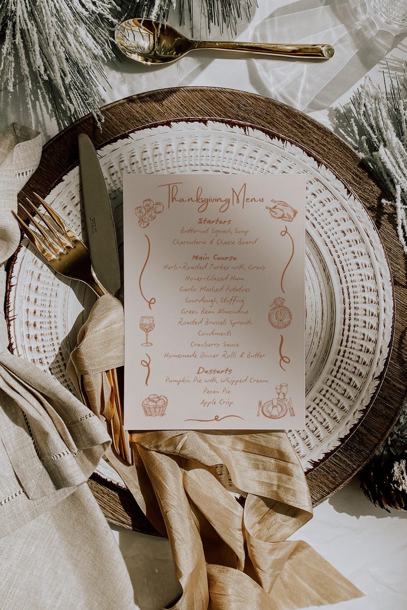 May include: Thanksgiving menu card on a white plate with gold silverware. The menu lists starters, main course, and desserts. The card is decorated with illustrations of food and drink.