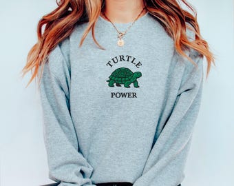 Turtle-sweater: geborduurde schildpad power ronde hals