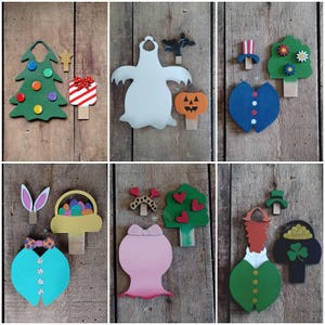 May include: A selection of wooden decorative pegs with seasonal themes. Designs include a Christmas tree, gift, ghost, pumpkin, patriotic suit, flowered tree, Easter basket, bunny ears, bow, heart tree, leprechaun, and pot of gold.