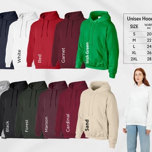 a man and woman standing next to each other wearing hoodies