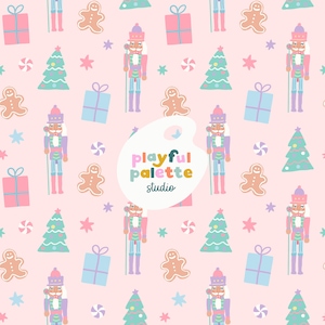 May include: A repeating pattern of Christmas-themed illustrations on a pink background. The design includes nutcrackers, gingerbread men, Christmas trees, gift boxes, stars, and candies. The text "playful palette studio" is also present.