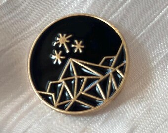 black and gold mountain pin
