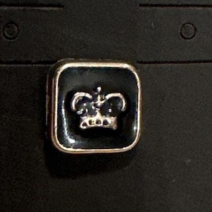 Black and silver crown push back hat pin