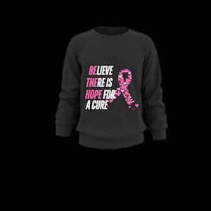 May include: Black long-sleeved sweatshirt with the text "Believe there is hope for a cure" and a pink ribbon made of pink hearts.