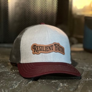 Resilient Faith,  Leather Patch Trucker hat. Black and Grey. Top quality & popular 6 Panel