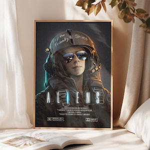 May include: A framed movie poster for "Aliens" featuring a person wearing a pilot helmet and sunglasses. The helmet has the text "Fly the Friendly Skies." The movie title is prominently displayed in white, with the rating "R" and Dolby logo visible.