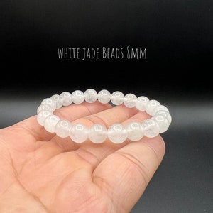 May include: White jade bead bracelet with 8mm beads.