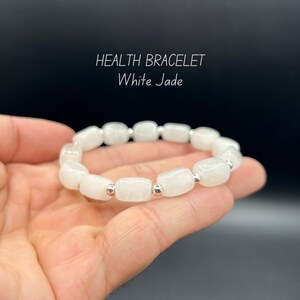 May include: White jade bracelet with silver beads. HEALTH BRACELET White Jade.