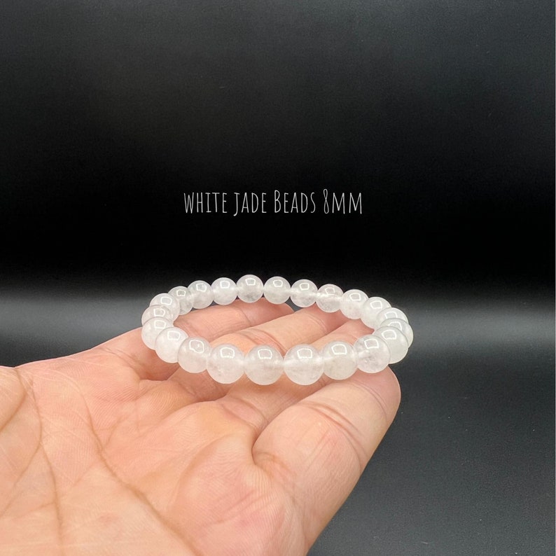 May include: White jade bead bracelet with 8mm beads.