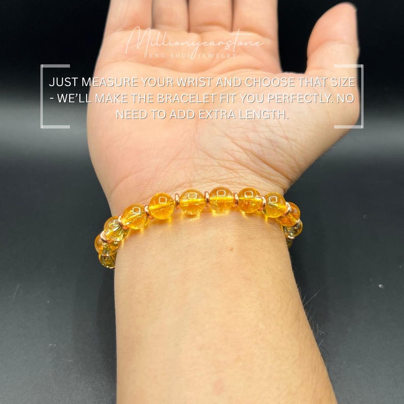 May include: A bracelet featuring amber-coloured, spherical beads and silver-toned spacers. The bracelet is displayed on a wrist. The image includes text: "JUST MEASURE YOUR WRIST AND CHOOSE THAT SIZE - WE'LL MAKE THE BRACELET FIT YOU PERFECTLY, NO NEED TO ADD EXTRA LENGTH."