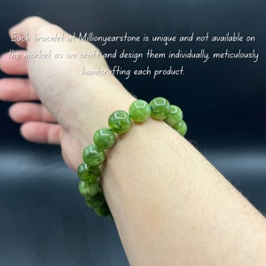 May include: A green beaded bracelet with large, round beads. The bracelet is worn on a wrist. Text in the image reads: "Each bracelet at Millionyearstone is unique and not available on the market as we craft and design them individually, meticulously handcrafting each product."