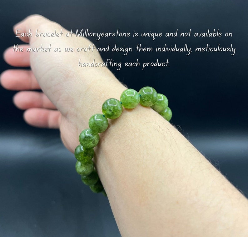 May include: A green beaded bracelet with large, round beads. The bracelet is worn on a wrist. Text in the image reads: "Each bracelet at Millionyearstone is unique and not available on the market as we craft and design them individually, meticulously handcrafting each product."