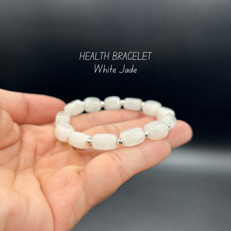 May include: White jade bracelet with silver beads. HEALTH BRACELET White Jade.