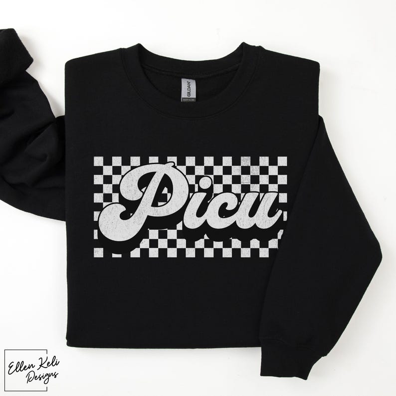 May include: Black sweatshirt with a white checkered pattern and the word "Picu" in a retro, white, cursive font.