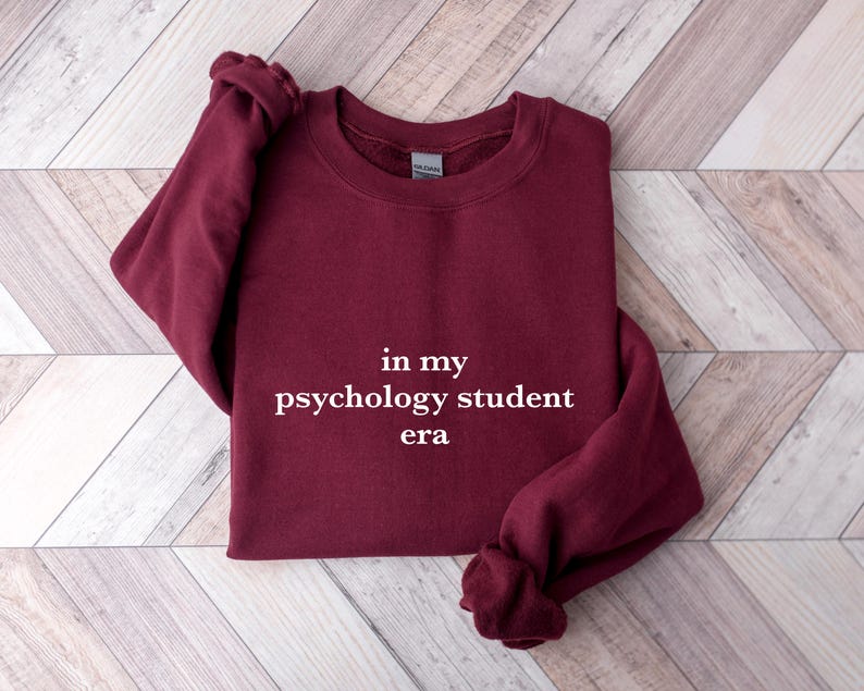 a red sweatshirt with the words in my psychology student era printed on it