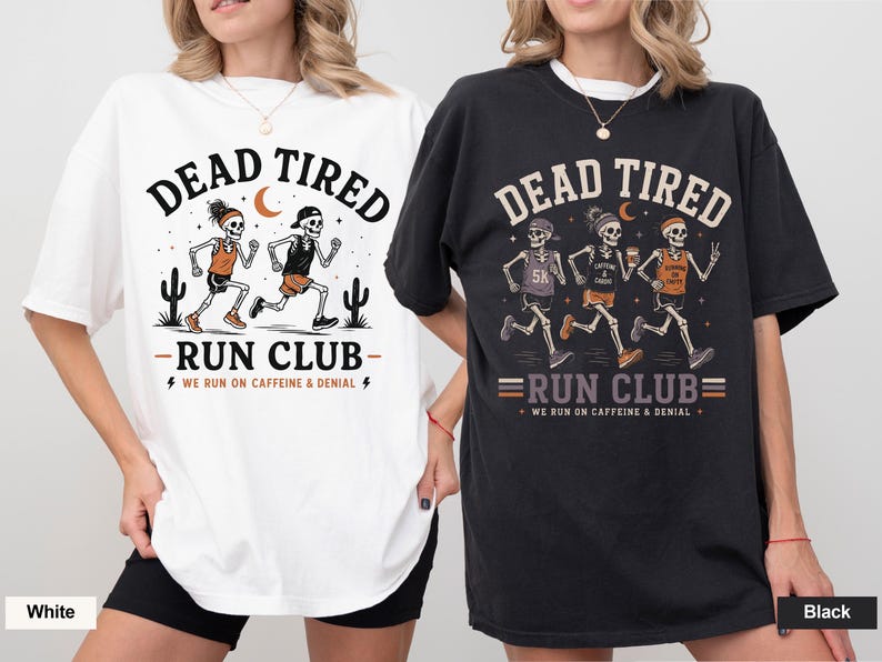 May include: A white t-shirt and a black t-shirt featuring a graphic of skeletons running. The white shirt shows two skeletons with the text DEAD TIRED RUN CLUB WE RUN ON CAFFEINE & DENIAL. The black shirt shows three skeletons with the same text.