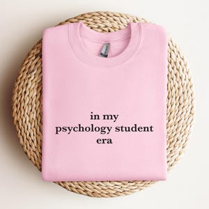 a pink t - shirt that says in my psychology student era