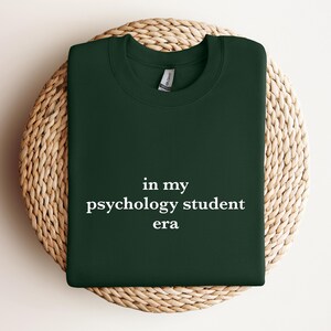 a green t - shirt that says in my psychology student era