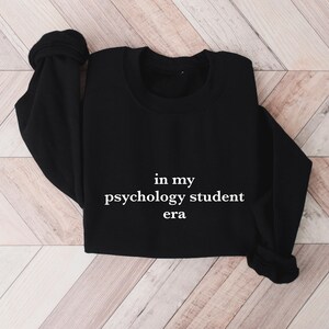 a black shirt that says in my psychology student era