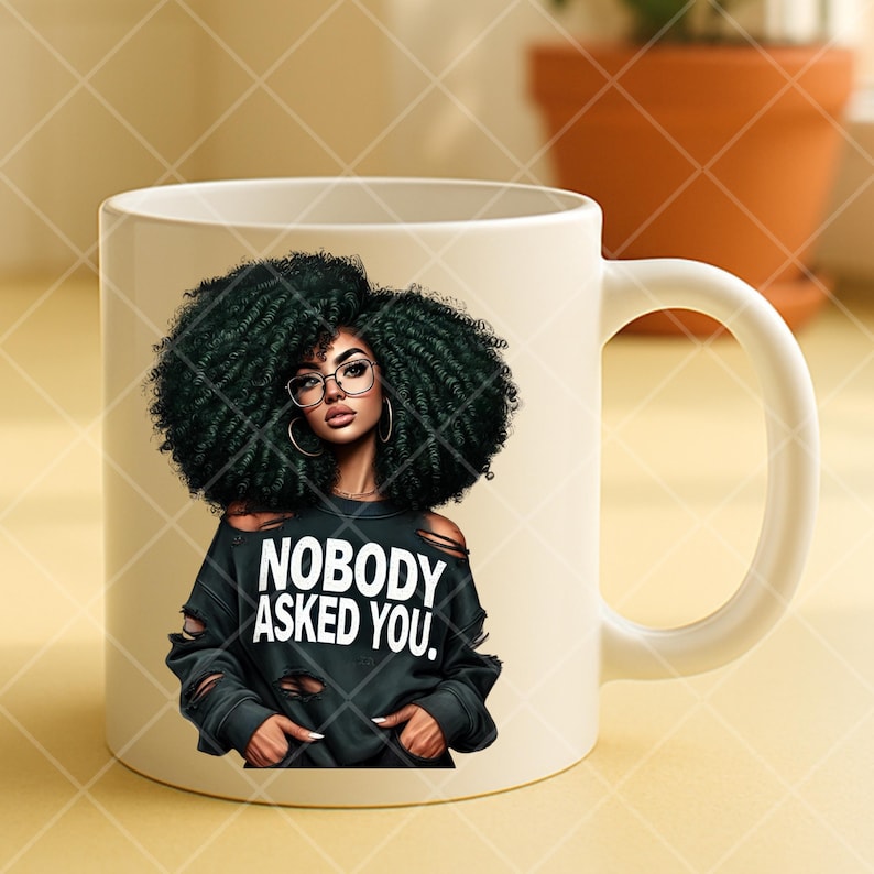 May include: White ceramic mug featuring a graphic of a woman with large, dark curly hair, glasses, and hoop earrings. She wears a black distressed sweatshirt with the text "NOBODY ASKED YOU." The mug has a curved handle.