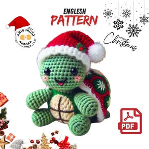 May include: Crochet pattern for a green turtle wearing a red and white Santa hat. The pattern is available as a PDF download. The image includes the text "English Pattern" and "Merry Christmas".