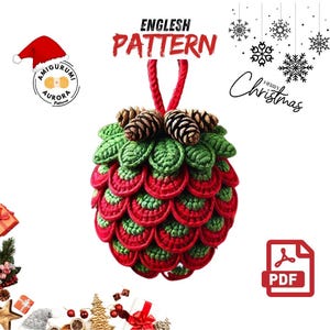 May include: A crocheted Christmas ornament shaped like a pinecone, featuring red and green scales, topped with small pinecones. The ornament has a red hanging loop and the text "ENGLISH PATTERN".