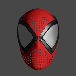 以下が含まれることがあります： 黒と赤のスパイダーマンのマスク。黒いクモの模様と白い目の部分があります。マスクには点々の模様があります。